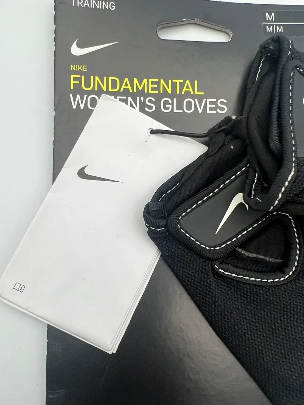 Nike Women's Black Fingerless Workout Gloves with White Swoosh